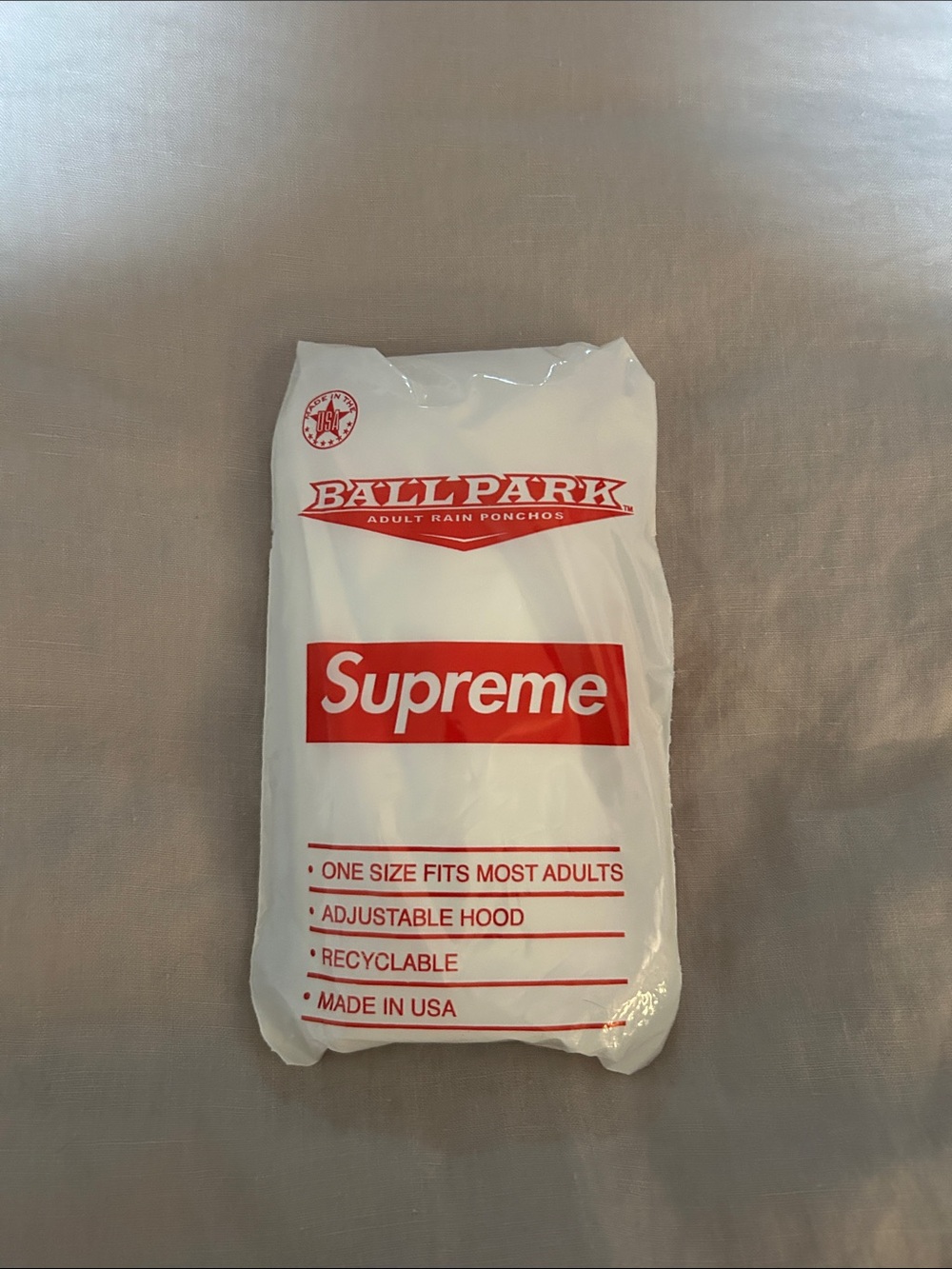 Supreme White Disposable Rain Poncho with Red Logo
